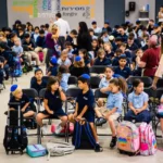 Students seated together during a school assembly.